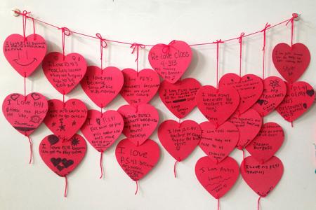 Fourth-graders in Mrs. Toomey and Mrs. Barone's ICT class show love for PS 41 on