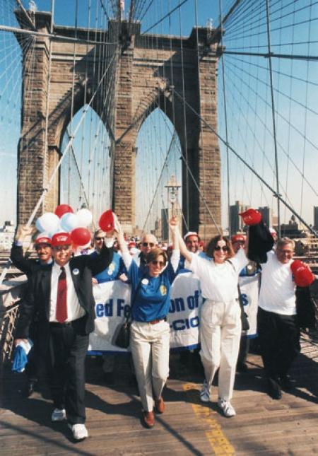 Randi Weingarten leads marchers across Brooklyn Bridge