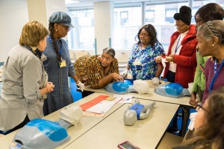 Participants learn CPR techniques