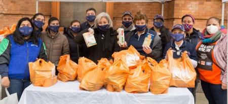 A group of teachers show off the food they've collected for chariy