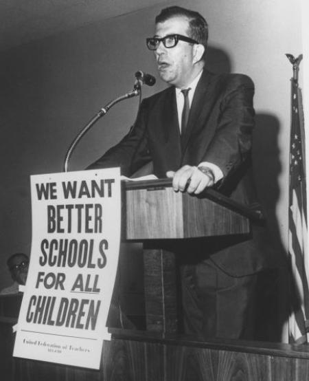 Albert Shanker giving a speech at a podium with a microphone