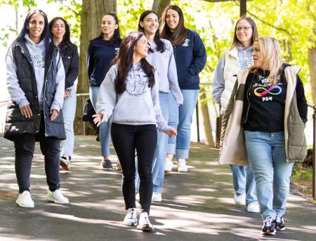 (Front row, from left) Teachers Janine Treglia and Jen Fabrizio lead colleagues on a lunchtime walk.