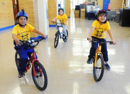 Three kids riding bikes