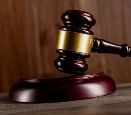 Wooden gavel on desk - Generic