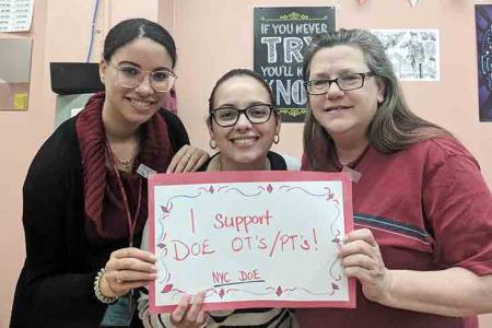Showing their pride with a handmade sign at Richmond Hill High School in Queens 