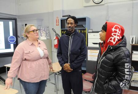 Teacher talking with students