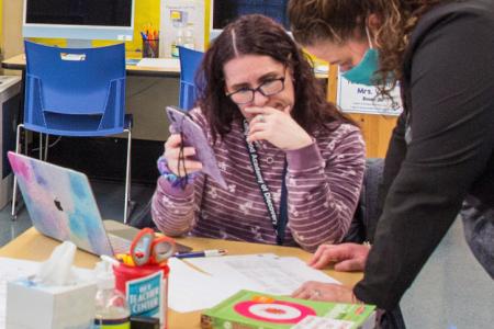 Educators at the Longwood Academy of Discovery meet in the new Teacher Center.