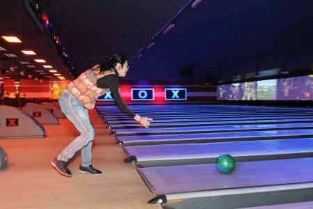 A person in a bowling alley.