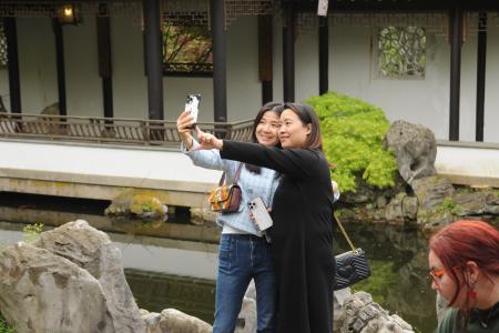 Two women pose for a selfie.