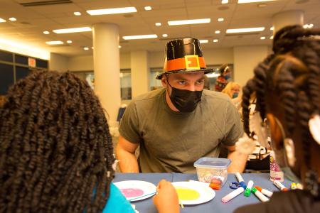  Volunteer Jonah Schjacker helps out with a crafts project.