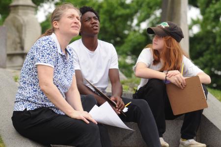 Girdo and two of her Park Slope Collegiate students survey the Green-Wood Cemetery during their architectural tour.