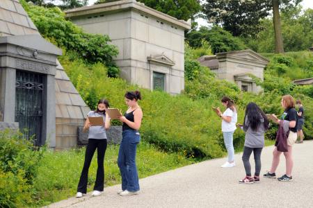 Park Slope Collegiate students end the tour by sketching a mausoleum and telling Wal-man what kind of architectural style it represents.