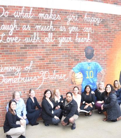 PS 82 educators, along with UFT District 28 Representative Angela Artis (sixth f