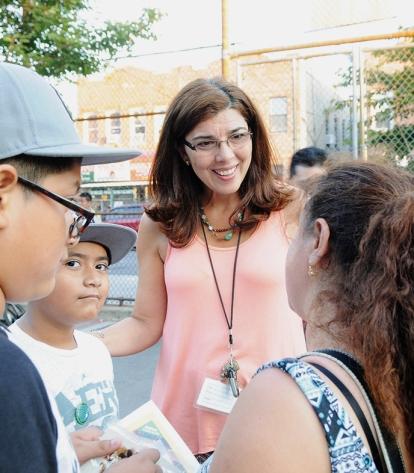 Guidance counselor Laura Jett gives information to a parent.