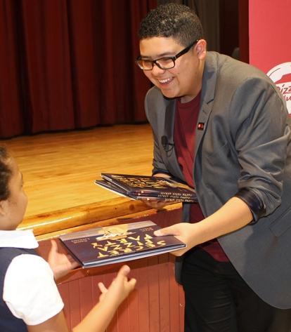 Actor Rico Rodriguez (from the television show “Modern Family”) distributes book