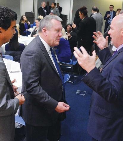 UFT President Michael Mulgrew (right) makes a point during a discussion with Cit