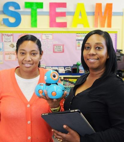 Paraprofessionals Judy Cruz (left) and Lanaya Bellamy.