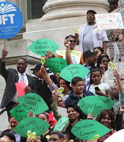 UFT member Everette Stembridge holds a UFT sign as he joins demonstrators.