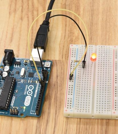An LED circuit configured with a microcontroller and a breadboard.