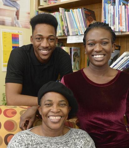 Sonia Dunkley (seated), with her son, Evly Davis, and daughter, Unique Nwahiri, 