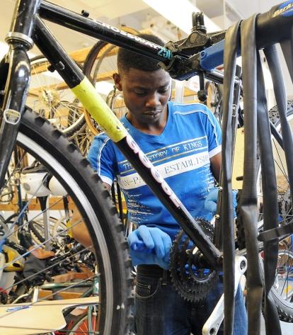 Trifon Douglas replaces the bottom bracket on a hybrid bike, a general-purpose b
