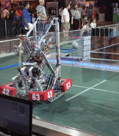 Lower East Side Prep’s robot takes to the playing field at the Javits Center.