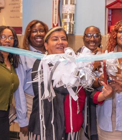 UFT Vice President for Education Evelyn DeJesus cuts the ribbon to open the new 
