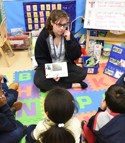 Kindergarten teacher Caitlyn Duffy reads a book with her students that they co-wrote as a group.