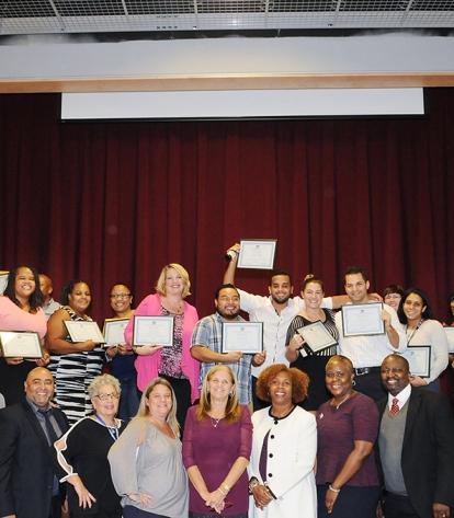 Award winners pose for a group shot with UFT and DOE officials.
