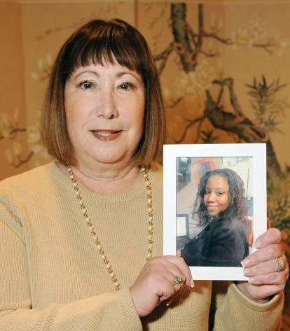 Hildy Krull shows a picture of her former student, Tracy.