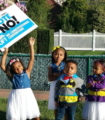 W.E.B. DuBois HS guidance counselor Nixon Jeanty’s four children pose with the f