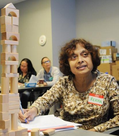 Rekha Desai, a substitute teacher in Queens, creates a block tower in a workshop