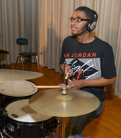 Jeremiah is at home on a drum set. “Being in the band has made Jeremiah more com