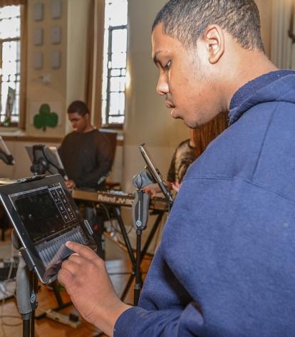 Nicholas plays his part on the iPad.