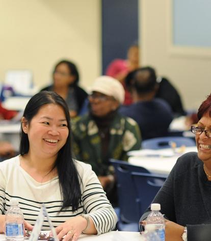 Parents Cindy Markelson (left) and Marilyn Vittini enjoy the workshop.