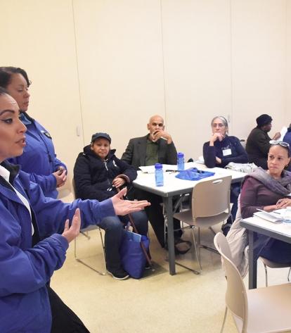 Police officers field a wide range of questions during a workshop.