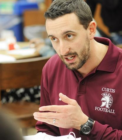 Joe Baratta, a teacher and success coach, tutors students who are football playe