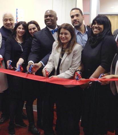 The ribbon is cut on Dec. 2 to officially open Curtis’ health center. Among thos