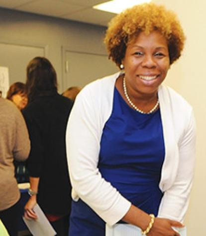 UFT Vice President for Elementary Schools Karen Alford (standing) checks in with