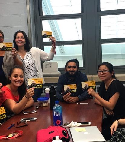 Members from Queens HS of Teaching have their postcards, on which they pledged t