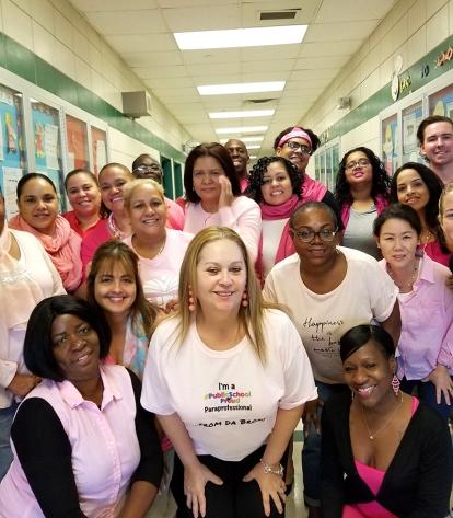 Staff at P 168 in the Bronx turn a hallway pink.