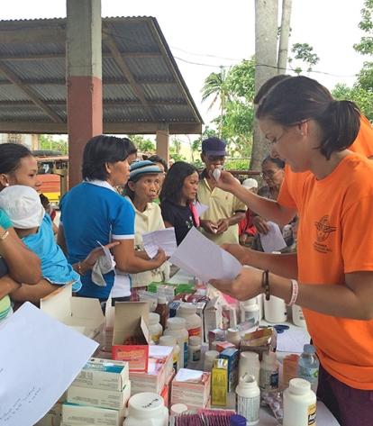 O’Regan reviews a prescription at the portable pharmacy, which was part of every
