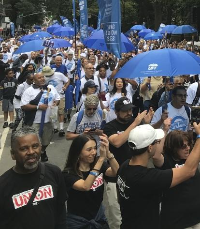 Parade of people wearing UFT T-shirts 