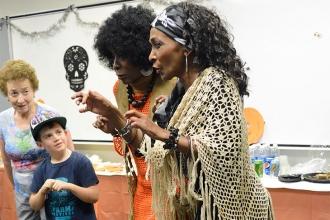 Kim Austin (right) and Scottie Davis (second from right) weave a tall and scary 