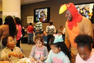Chapter Advocate Rashad Brown dons a turkey costume to the delight of children d