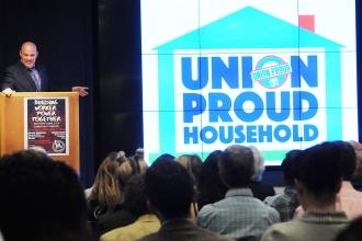 UFT President Michael Mulgrew shows off one of the posters members can display i