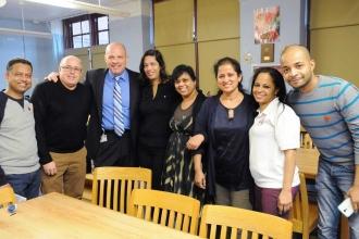 Mulgrew poses for a photo with IS 145 staff after a meeting at the school.