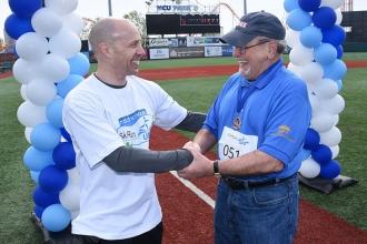 UFT Vice President for Middle Schools Richard Mantell (left) congratulates UFT T