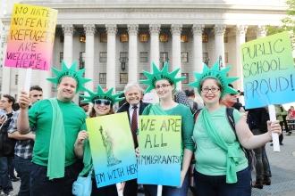 UFT Treasurer Mel Aaronson (center) joins (from left) Jake Thomas, a teacher at 