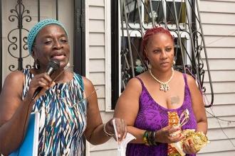 City Councilwoman Inez Barron (left) congratulates child care provider Regina Ca